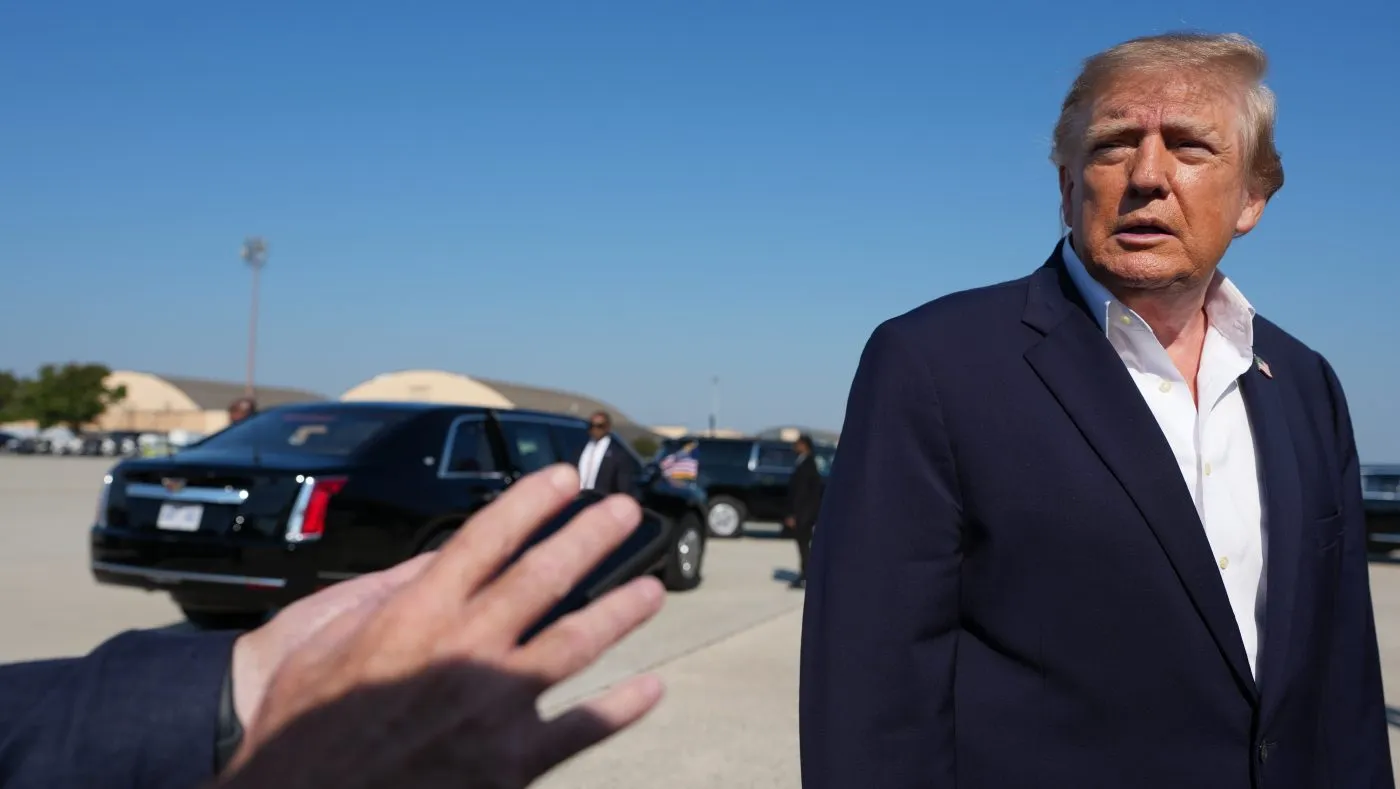 President Donald Trump speaks to media before boarding Air Force One, Tuesday, Oct. 27, 2026, at Joint Base Andrews, Md. (AP Photo/Alex Brandon)
