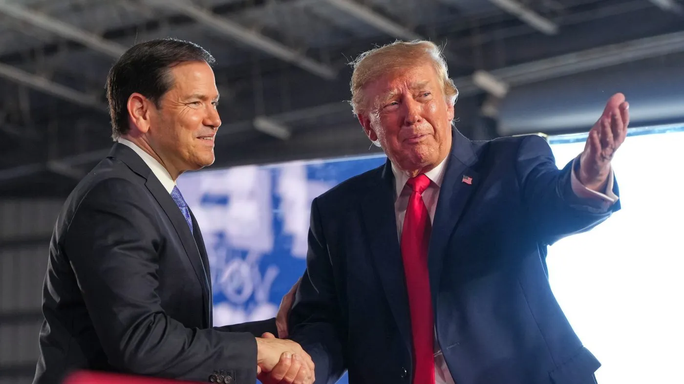 President Trump greets Secretary of State Marco Rubio at a campaign rally at the Port of Corpus Christi on Oct. 27, 2026, in Corpus Christi, Texas.