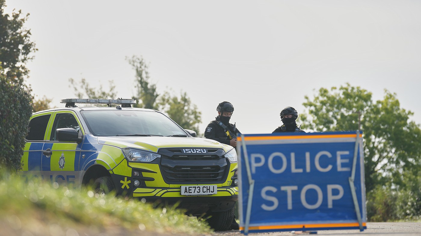 Police guard a road leading to RAF Fairford, in Fairford, England, Sept. 28, 2026. (Alastair Grant, Associated Press)