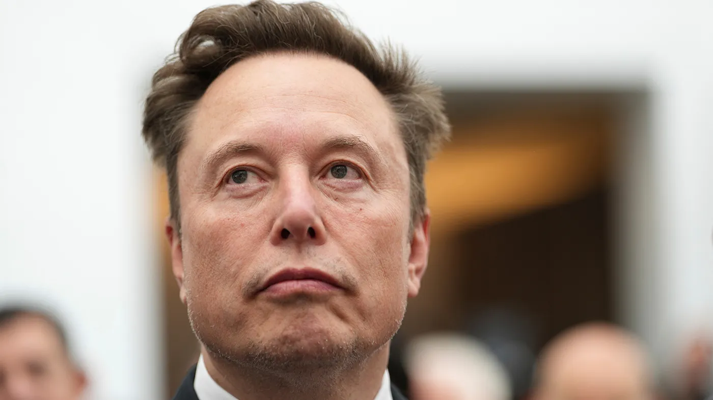 Elon Musk listens as President Donald Trump speaks during an event at the U.S. Institute of Peace, Oct. 8, 2026, in Washington.