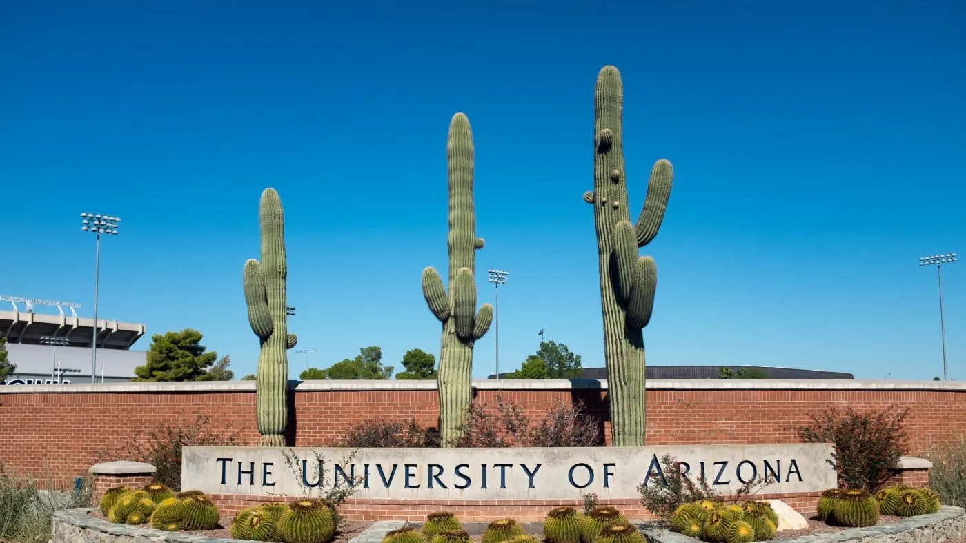 A sign in front of some cacti mark one of the entrances to the University of Arizona, in Tucson, Arizona. The University was founded in 1885 and was the first university in the Arizona Territory. (Photo by Epics/Getty Images)