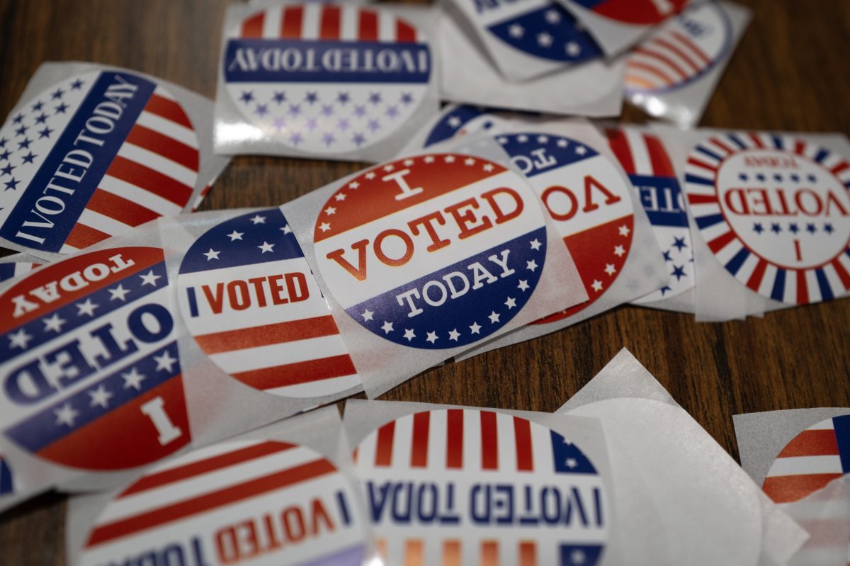 LITTLE CHUTE, WISCONSIN – NOVEMBER 01: Stickers sit on a table during in-person absentee voting on November 01, 2024 in Little Chute, Wisconsin. Election day is Tuesday November 5. (Photo by Scott Olson/Getty Images)