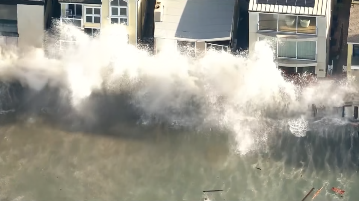 Powerful waves produced by Tropical Storm Rachel pound the Long Beach Peninsula. (KTLA)