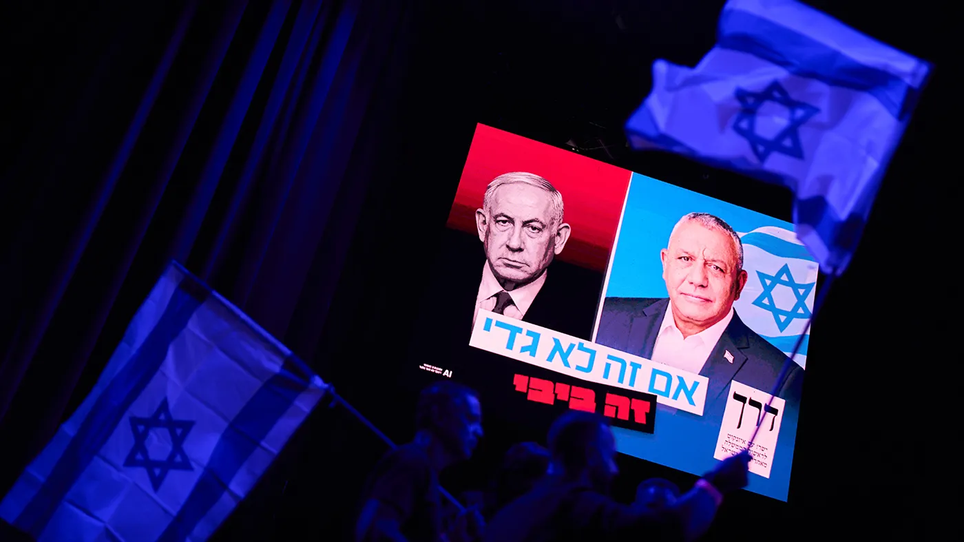 A screen projects an image of Israeli Prime Minister Benjamin Netanyahu, left, and his main rival, opposition candidate Gadi Eisenkot, leader of the Yashar (“Straight”) party, during a campaign rally for Eisenkot ahead of Israel’s general election, Oct. 25, 2026, in Tel Aviv, Israel.