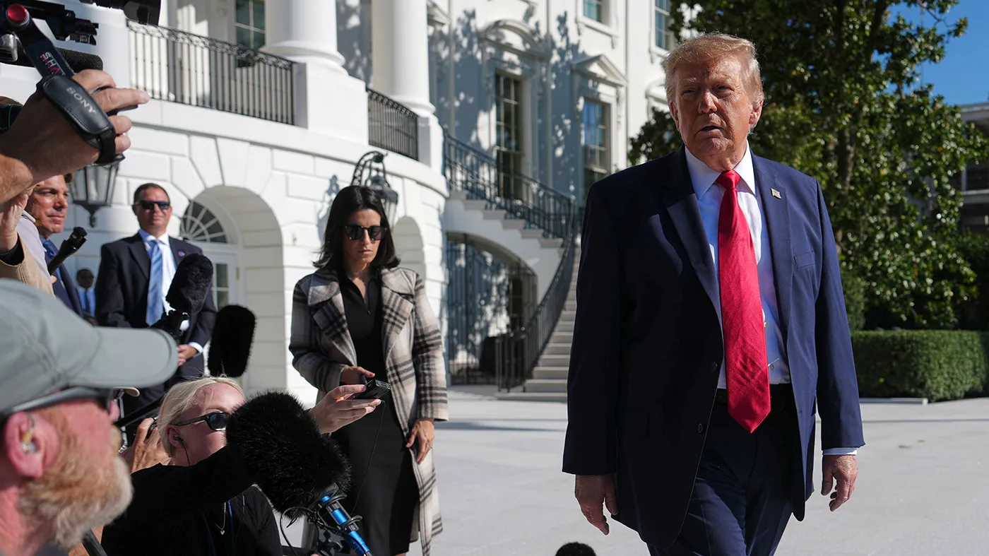 President Trump speaks with reporters before boarding Marine One on the South Lawn of the White House, Oct. 23, 2026, in Washington.