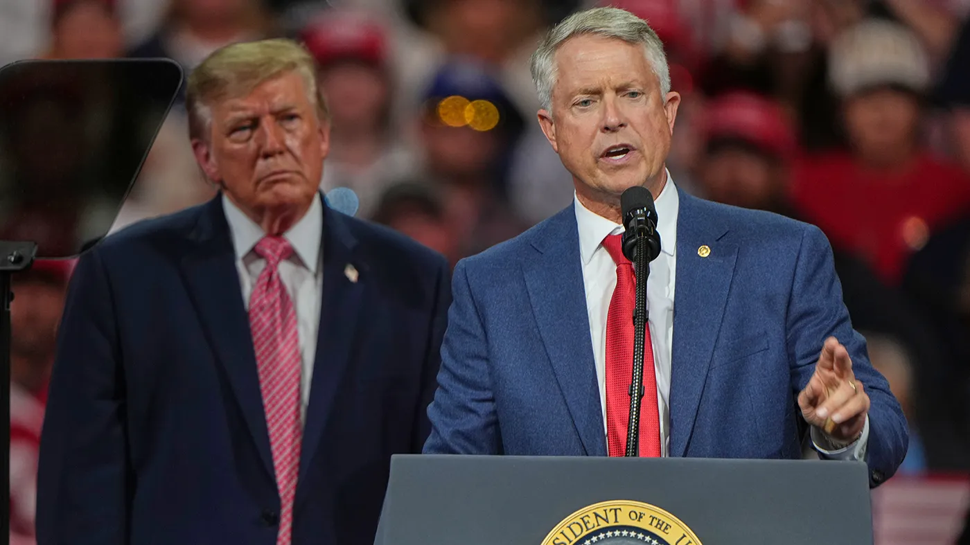 President Trump listens as Sen. Roger Marshall (R-Kan.) speaks at a campaign rally at Heartland Credit Union Arena, Oct. 19, 2026, in Park City, Kan. (Charlie Riedel, Associated Press)