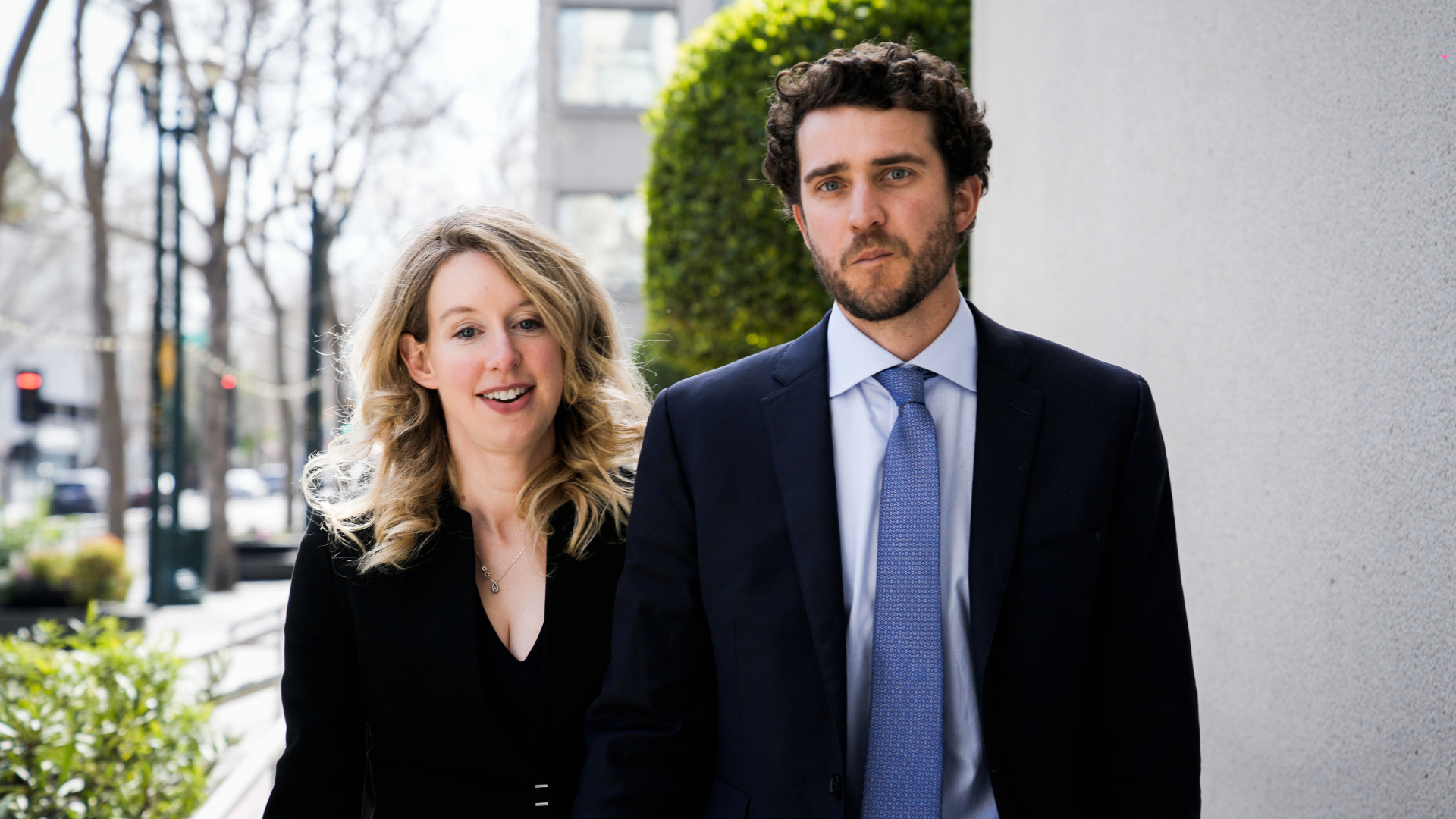 SAN JOSE, CA – MARCH 17: Former Theranos CEO Elizabeth Holmes alongside her boyfriend Billy Evans, leaves a hearing at the Robert E. Peckham U.S. Courthouse on March 17, 2023 in San Jose, California. Holmes appeared in court for a restitution hearing. (Photo by Philip Pacheco/Getty Images)