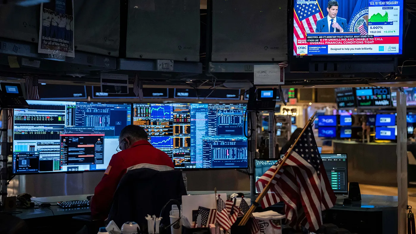 A screen displays a news conference by Federal Reserve Board Chairman Kevin Warsh on the floor of the New York Stock Exchange, Oct. 28, 2026, in New York. (Yuki Iwamura, Associated Press)