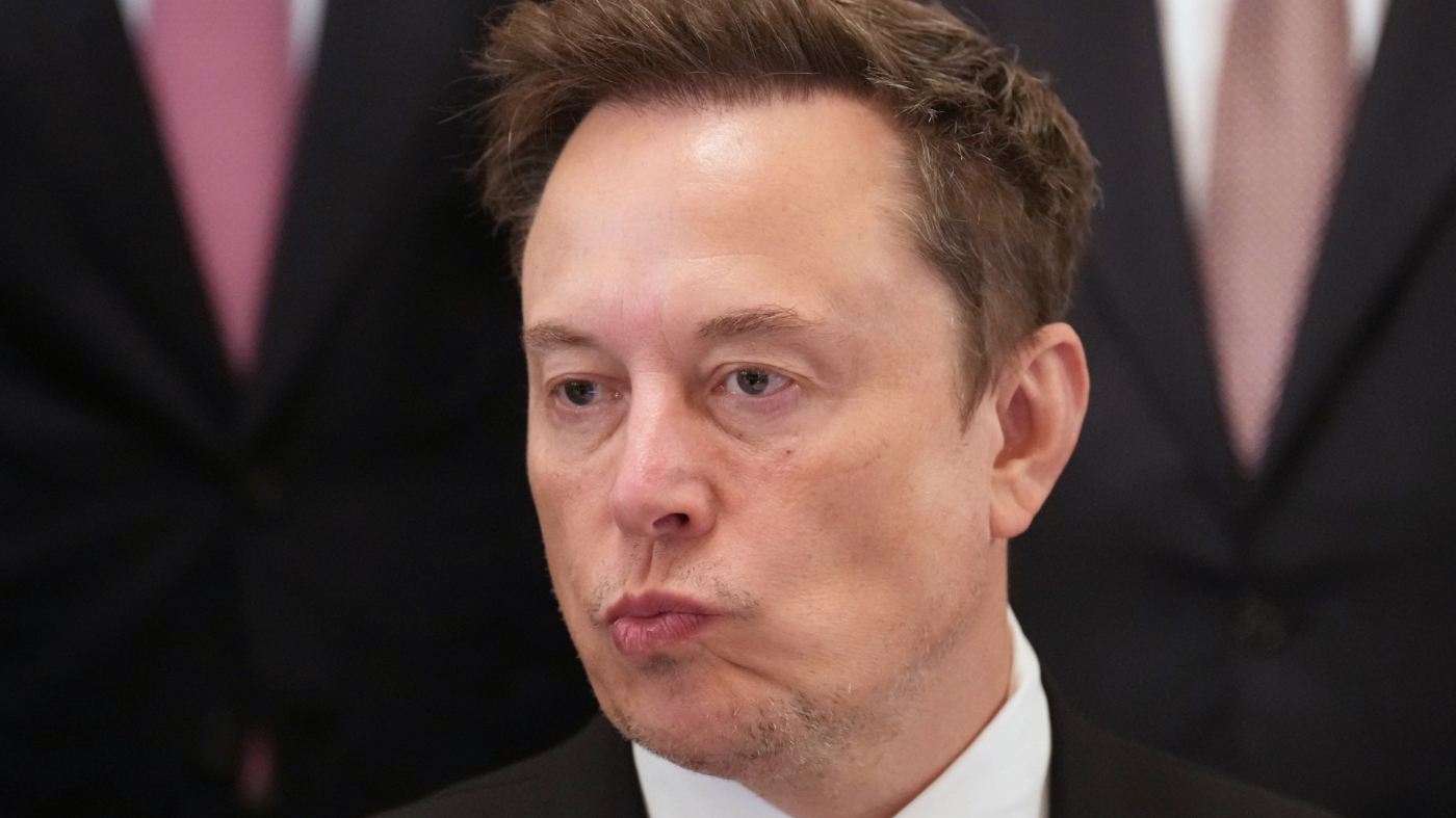 Elon Musk listens as President Trump speaks in the East Room of the White House in Washington, Sept. 29, 2026, during a meeting with top executives of AI firms.
