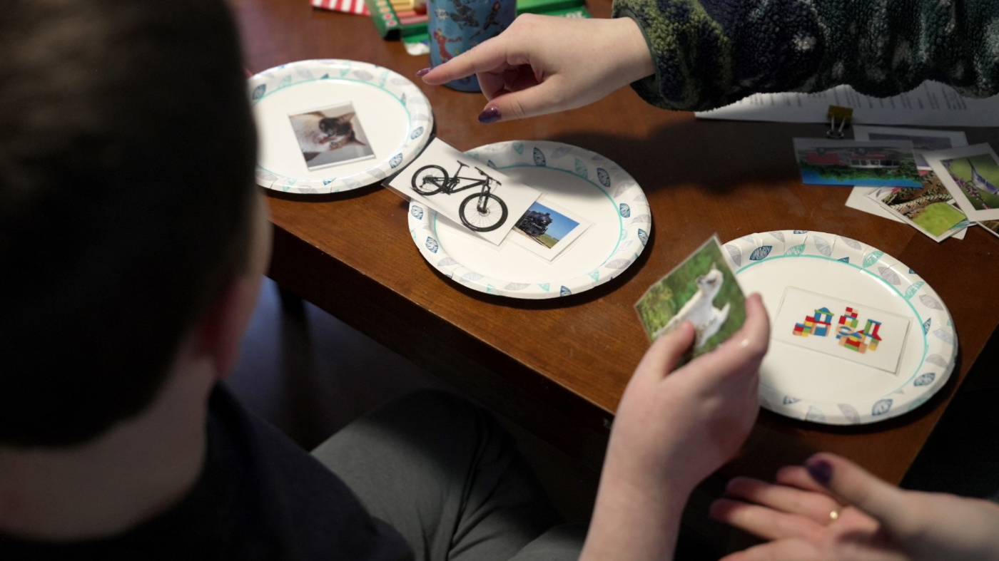 Ronan Murphy works on a sorting problem during an applied behavior analysis after school in his home in Ayer, Mass., on Friday, Jan. 16, 2026. (AP Photo/Shelby Lum)