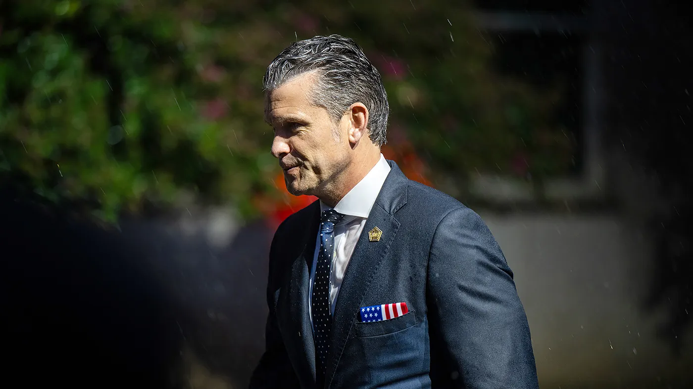 Defense Secretary Pete Hegseth exits following the U.S. flag unfurling on the west side of the Pentagon to mark 25 years since the 9/11 terrorist attacks in Arlington, Va., on Sept. 11, 2026.