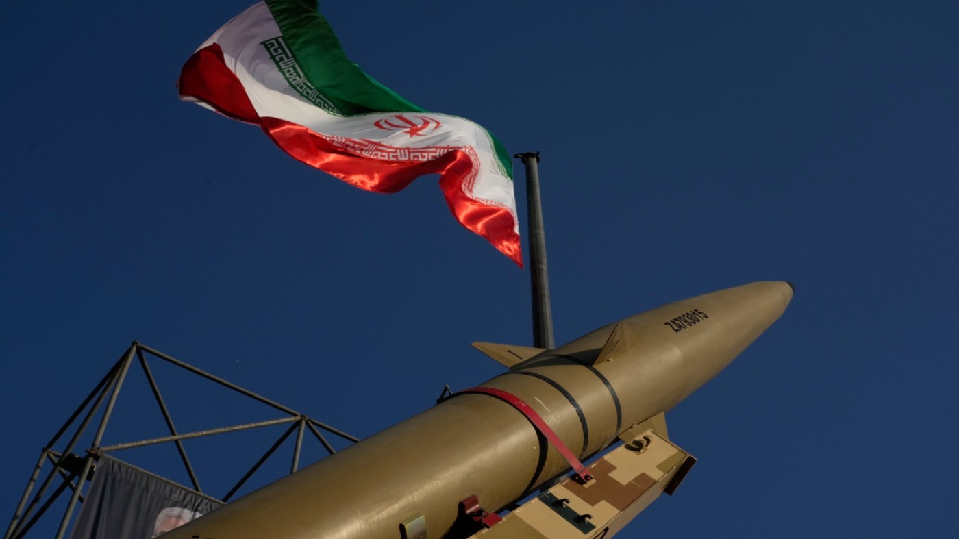 An Iranian missile is displayed under the country’s national flag in a military exhibition commemorating the anniversary of the start of the 1980-88 Iraq-Iran war at Baharestan Square, in Tehran, Monday, Sept. 28, 2026. (AP Photo/Vahid Salemi)