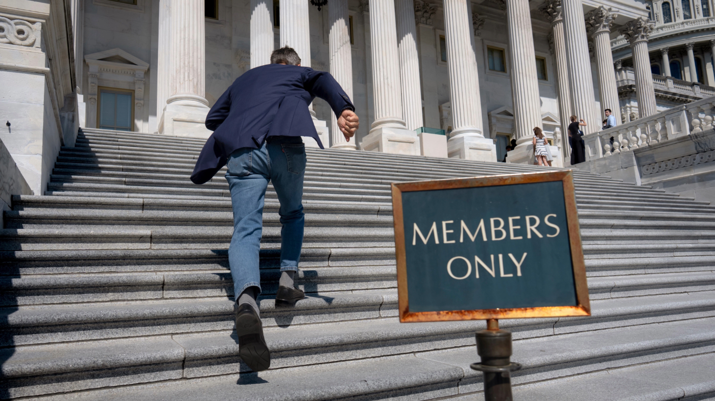 Rep. Darrell Issa, R-Calif., rushes up the steps at the Capitol for final votes before the House of Representatives leaves for a five-week recess, in Washington, Thursday, July 23, 2026. (AP Photo/J. Scott Applewhite)