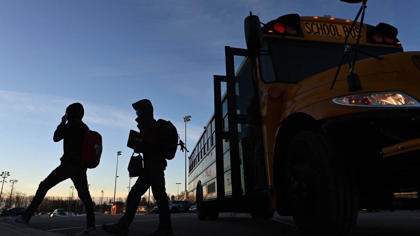 Students arrive by bus at West Springfield High School on Jan. 10, 2022, in Springfield, Va. Fairfax County Schools reopened after winter break and an additional week off for weather.