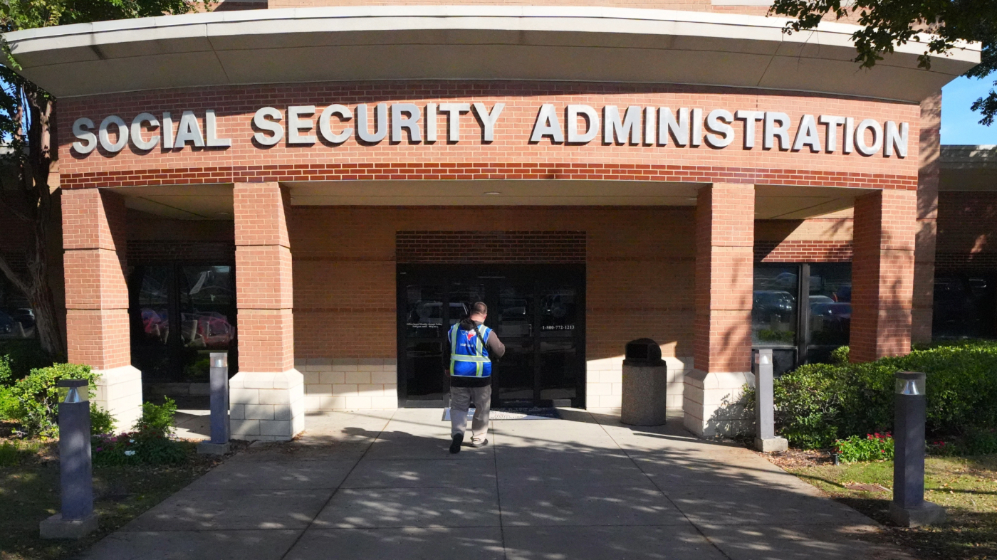 A person walks into the Social Security Administration office in Dallas, Friday, Oct. 23, 2026. (AP Photo/LM Otero)