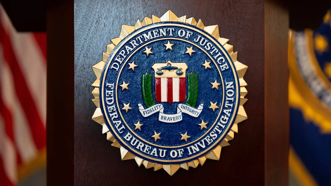FILE – An FBI seal is displayed on a podium before a news conference at the field office in Portland, Ore., Jan. 16, 2025. (AP Photo/Jenny Kane, File)