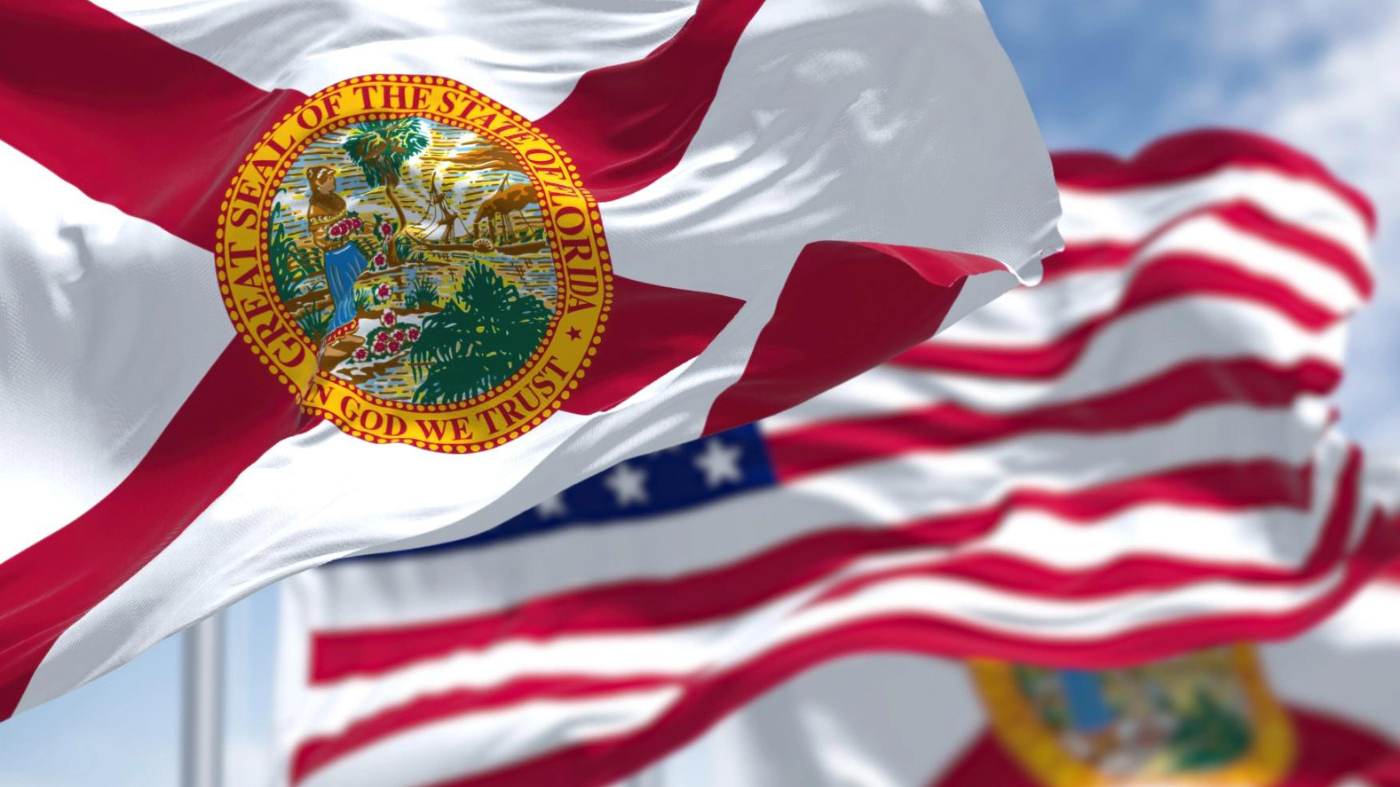 The Florida state flag waving along with the USA flag. (Getty Images)
