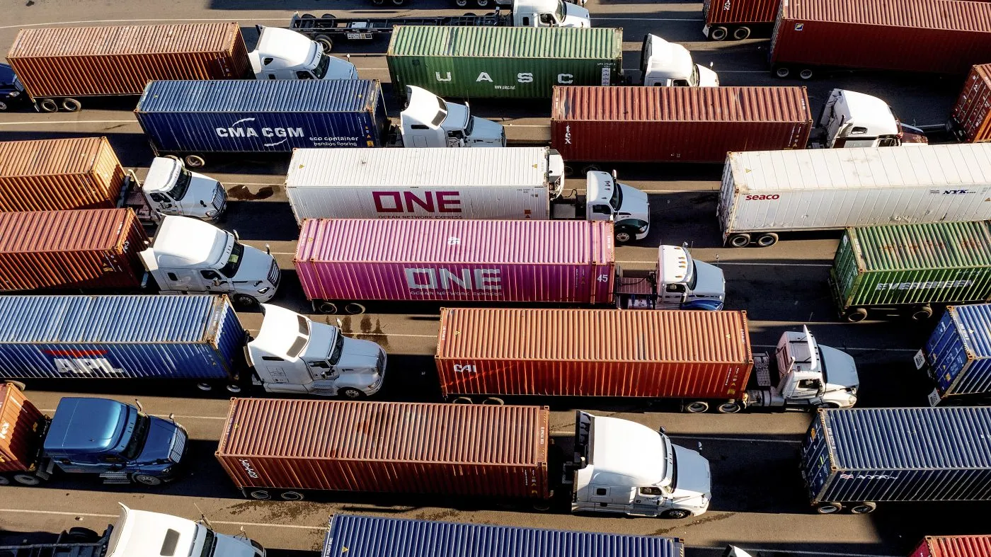 Trucks line up to enter a Port of Oakland shipping terminal on Nov. 10, 2021, in Oakland, Calif.