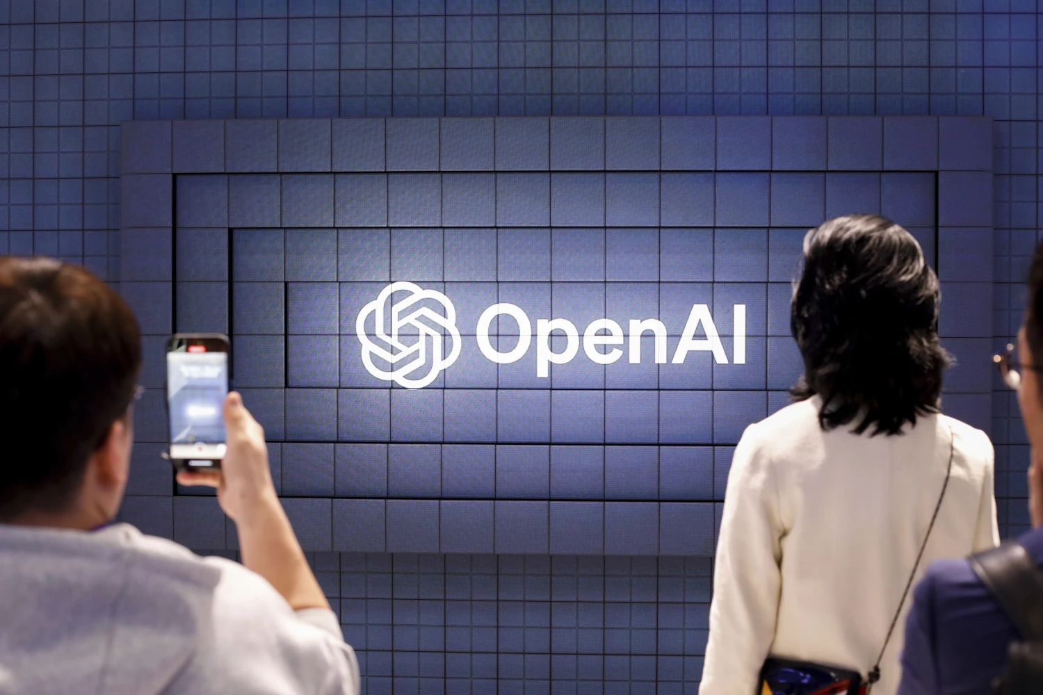 A screen announcing OpenAi at a trade show in Barcelona in February 2024.