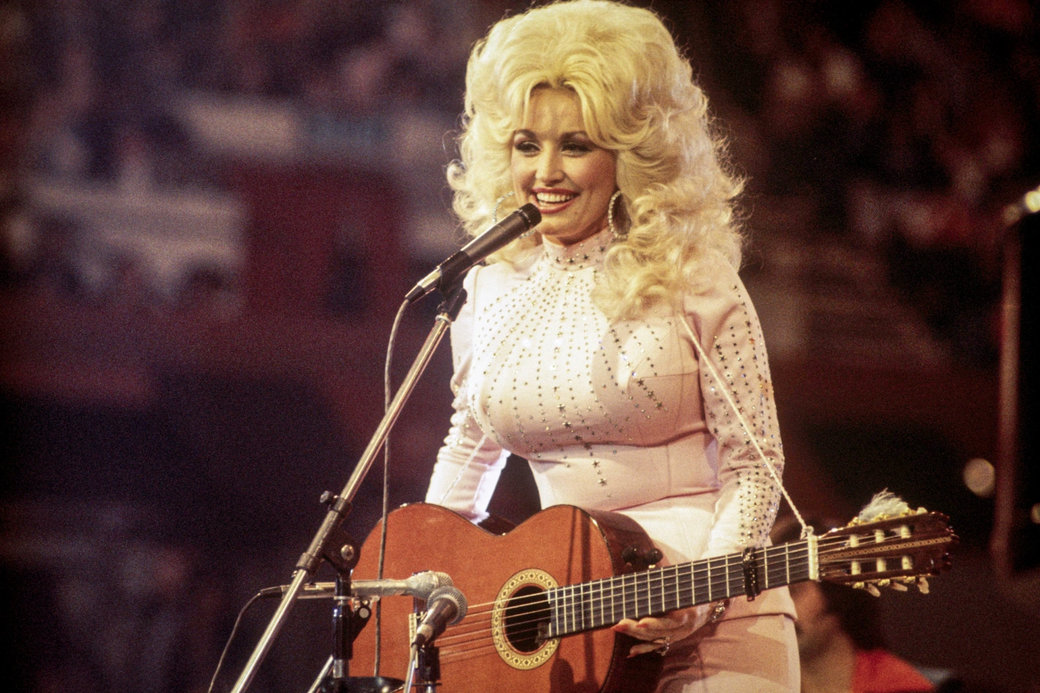 Dolly Parton performs in 1976.