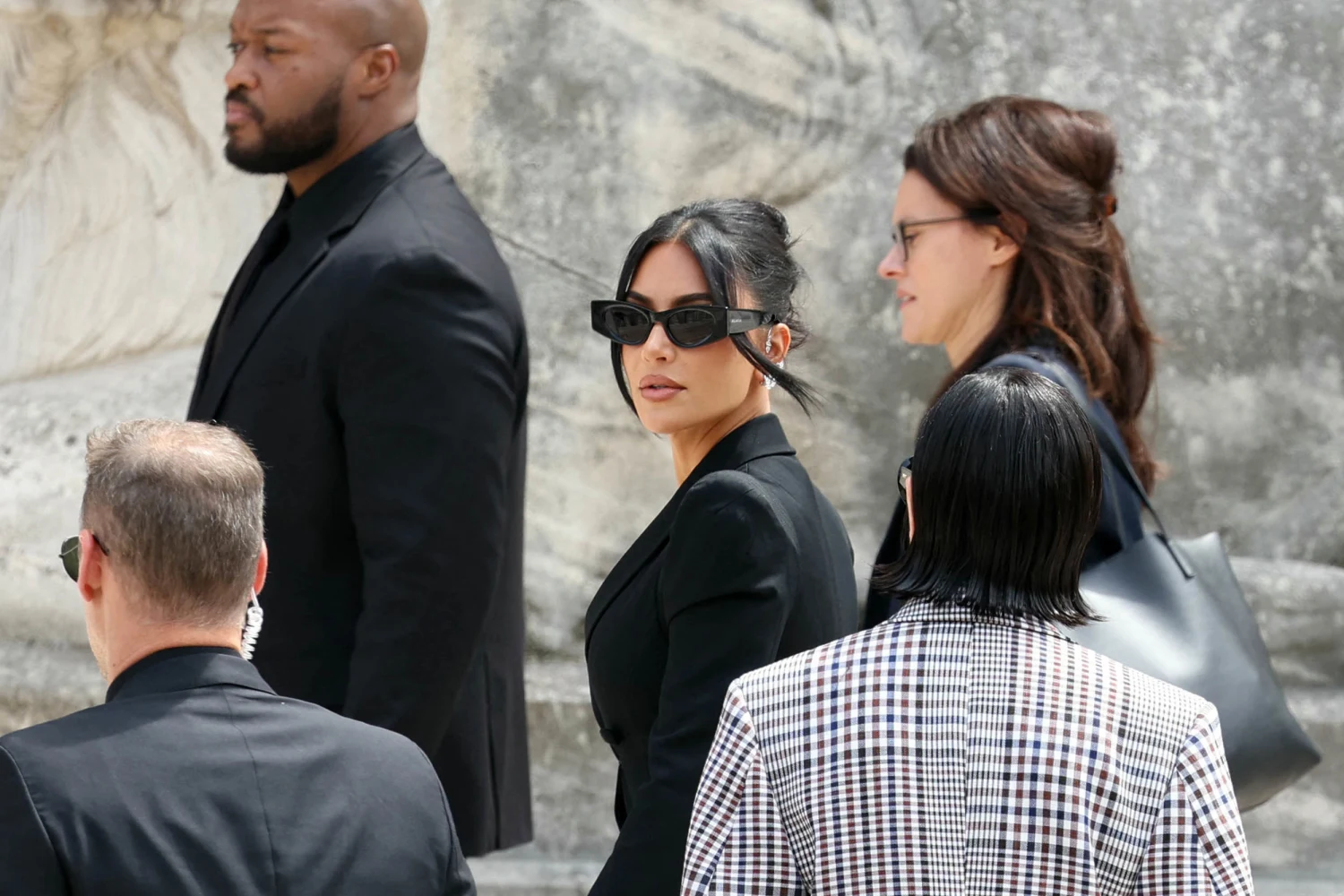 Kim Kardashian arrives to the Assize Court for the trial during which she will  testify over the 2016 robbery that saw her relieved of millions of dollars' worth of jewellery at gunpoint at  in Paris, on May 13, 2025.