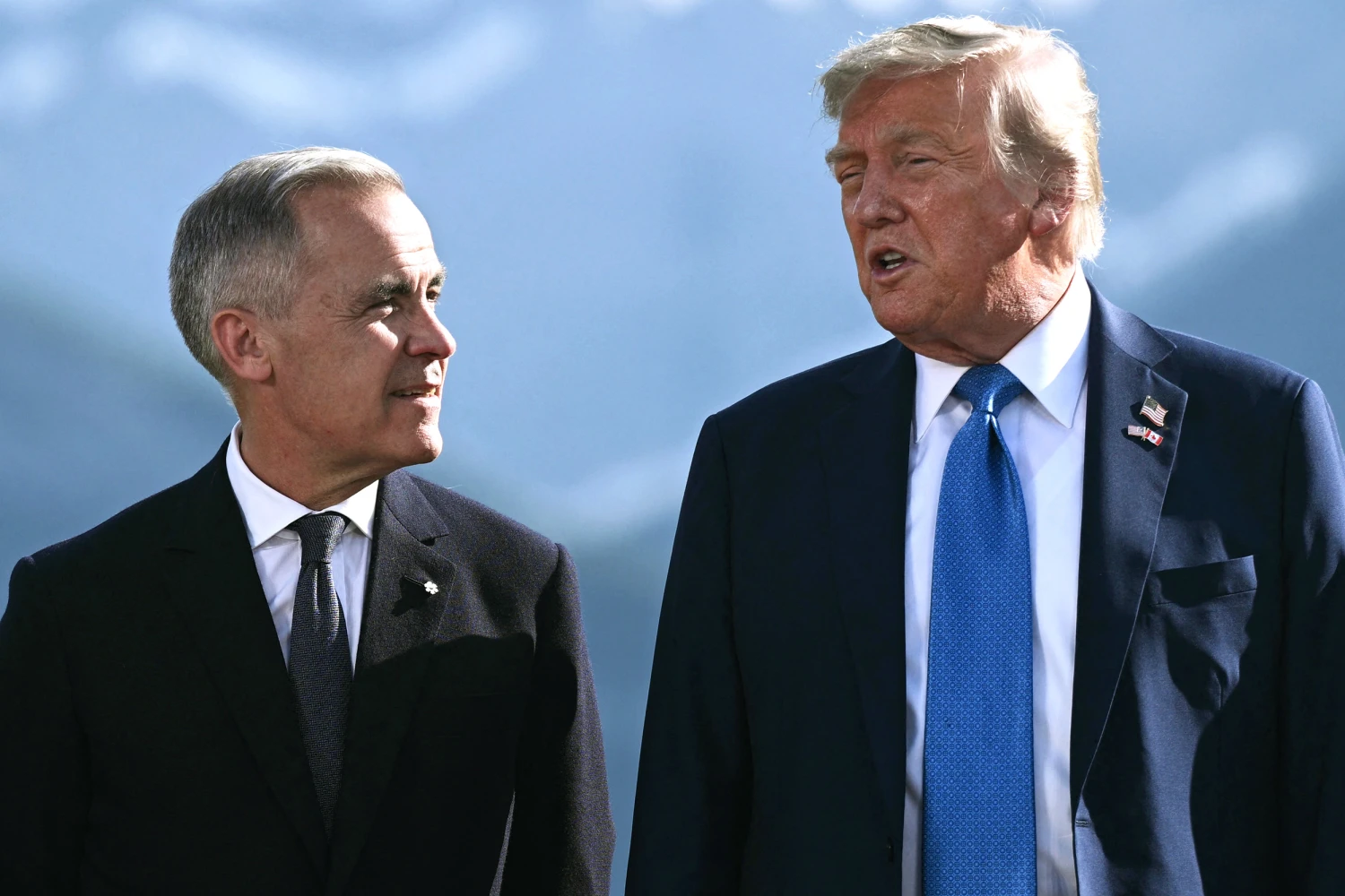 Canadian Prime Minister Mark Carney and President Donald Trump pose for a family photo during the Group of Seven (G7) Summit at the Kananaskis Country Golf Course in Kananaskis, Alberta, Canada on June 16, 2025. 