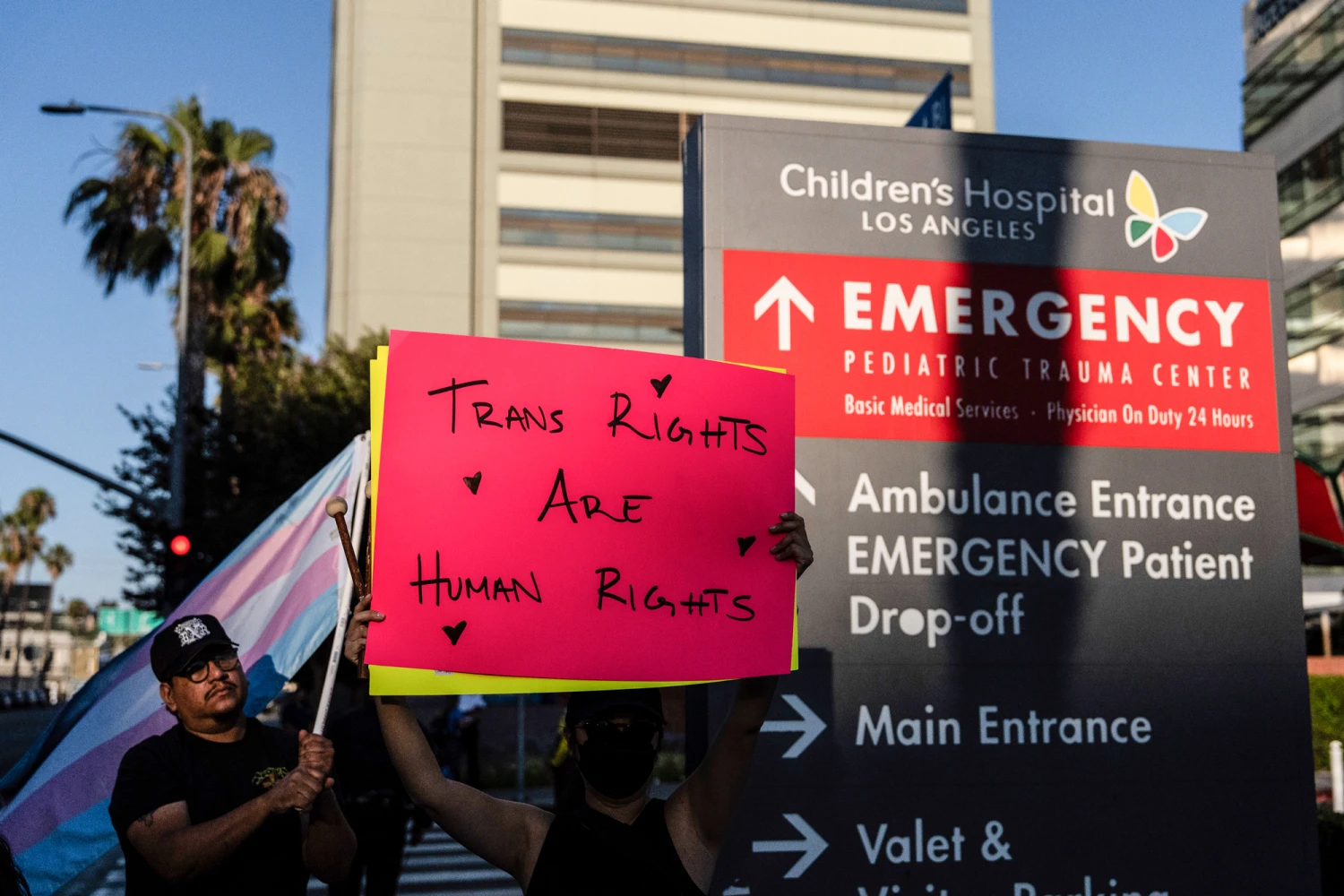 Protesters demonstrate against the planned closure of the trans youth clinic at Children's Hospital Los Angeles, in Los Angeles, on July 3, 2025.