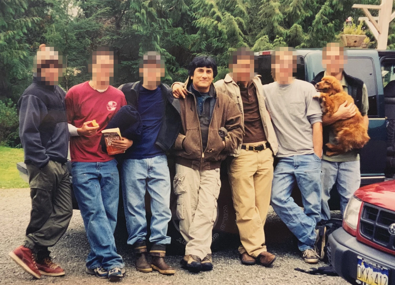 Daniel Savala poses with young followers in Alaska in 2002.
