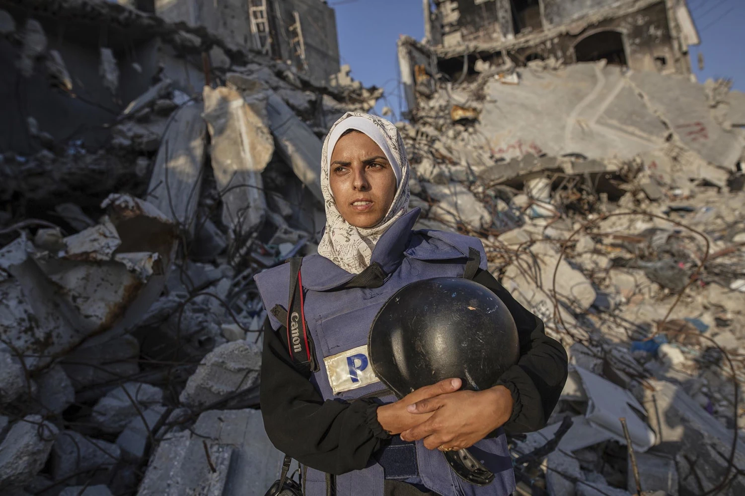 Freelance photojournalist Mariam Dagga, 33, who had been working with the Associated Press and other outlets during the Gaza war, poses for a portrait in Khan Younis, southern Gaza Strip, on June 14, 2024. She was among at least 19 people, including four journalists, killed Monday in Israeli strikes on Nasser Hospital in Khan Younis.