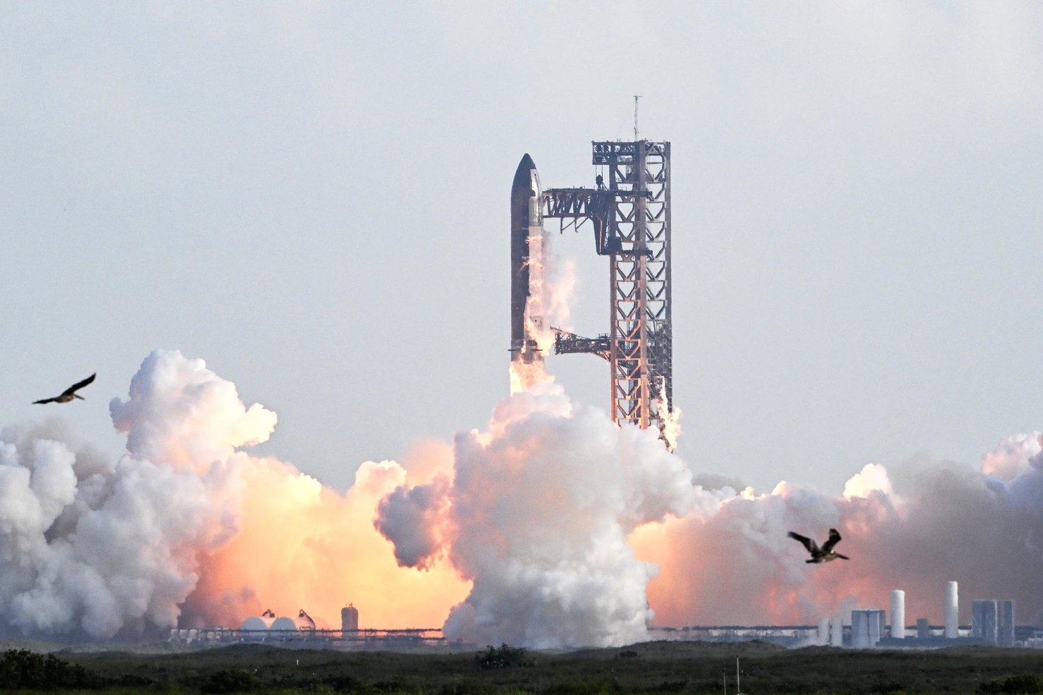 SpaceX's Starship rocket lifts off from Starbase, Texas, as seen from South Padre Island on August 26, 2025, for its tenth test flight.