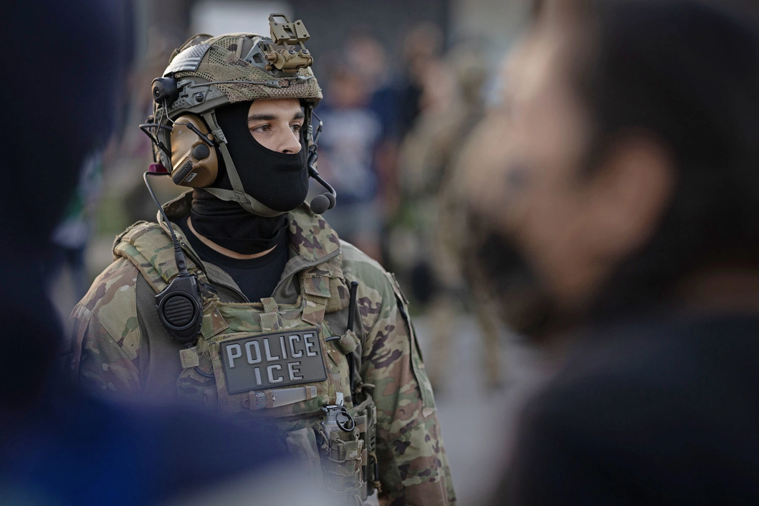 An ICE agent confronts demonstrators protesting outside of an immigrant processing center on Sept. 27, 2025 in Broadview, Ill.