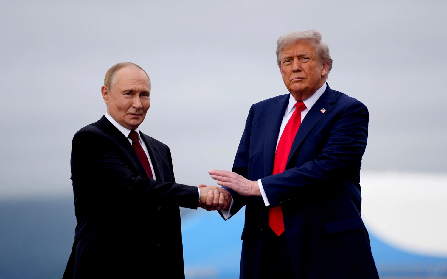 President Donald Trump greets Russian President Vladimir Putin at Joint Base Elmendorf-Richardson on Aug. 15  in Anchorage, Alaska.