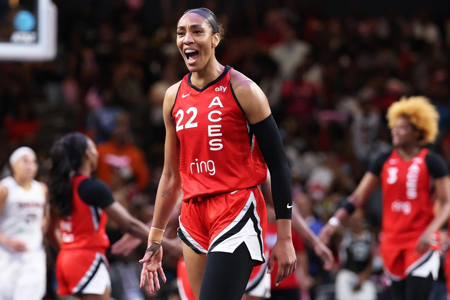 A'ja Wilson #22 of the Las Vegas Aces reacts after a basket and a foul by Chelsea Gray #12 against the Atlanta Dream during the fourth quarter at Gateway Center Arena on August 27, 2025 in College Park, Georgia.