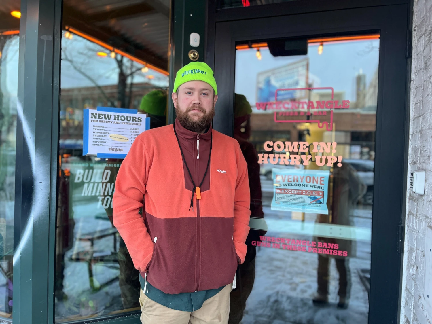 Jeff Rogers stands in front of the doorway to Wrecktangle Pizza, where federal officers are denied entry, in Minneapolis, Minn., on Jan. 22, 2026.