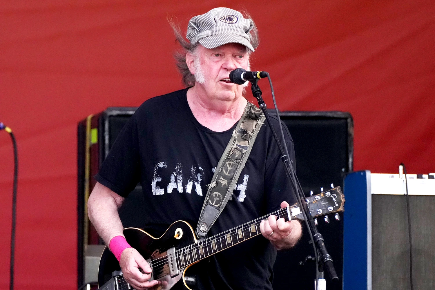 Neil Young of Crazy Horse performs onstage during the 2024 New Orleans Jazz & Heritage Festival at Fair Grounds Race Course on May 04, 2024 in New Orleans, Louisiana.
