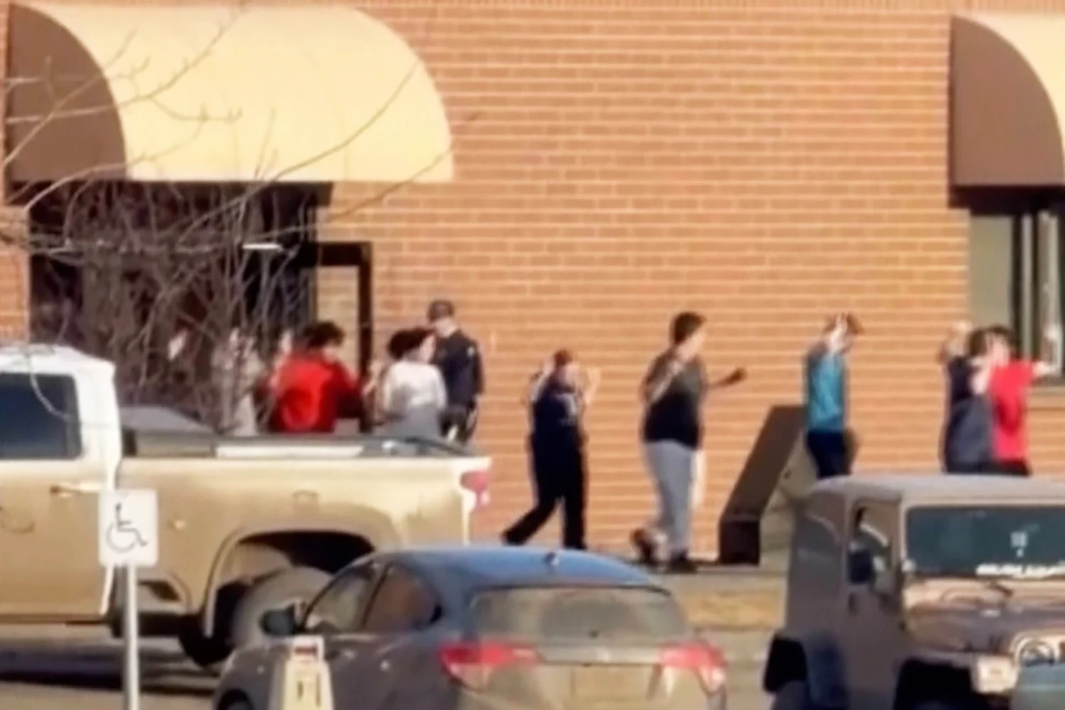 Students leave Tumbler Ridge Secondary School in British Columbia on Feb. 10 after deadly shootings in a screenshot from video.