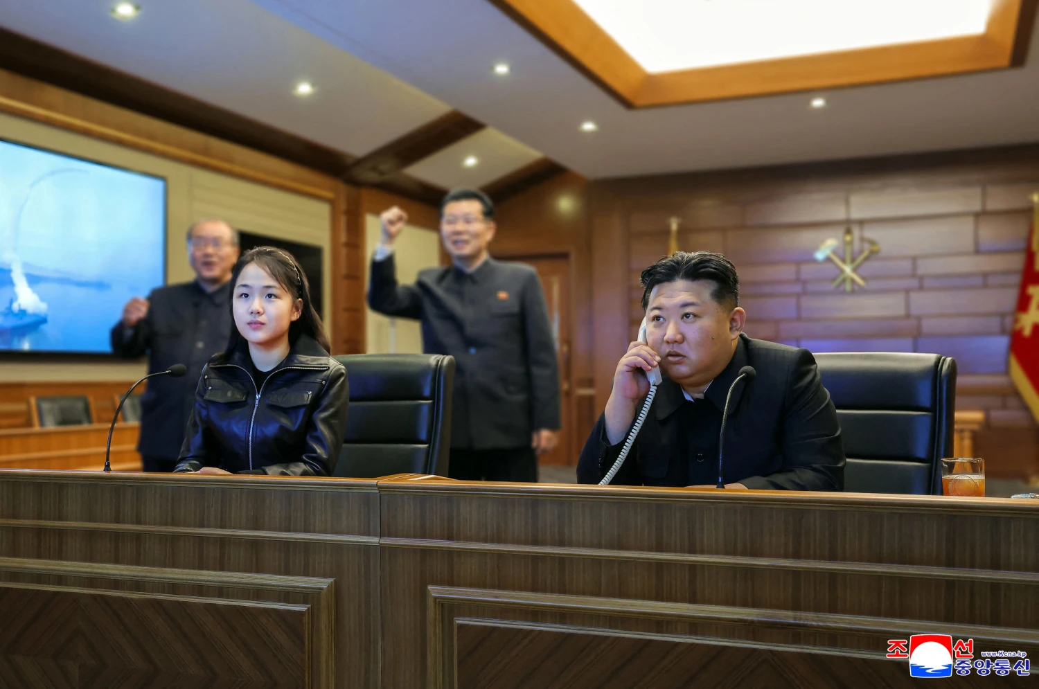North Korean leader Kim Jong Un and his daughter Kim Ju Ae watch a televised test-firing of strategic cruise missiles at an undisclosed location in North Korea on March 11, 2026.