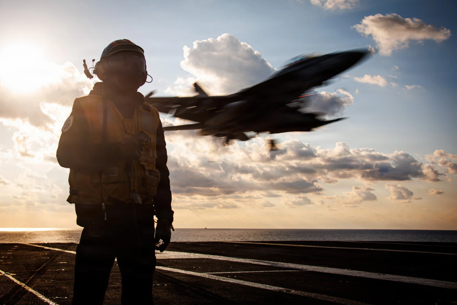 A U.S. Sailor serves as arresting gear officer as an F/A-18F Super Hornet aircraft, attached to Strike Fighter Squadron 213, lands on the flight deck of the world's largest aircraft carrier, USS Gerald R. Ford (CVN 78), while operating in support of Operation Epic Fury on March 2, 2026 in the Mediterranean Sea. 
