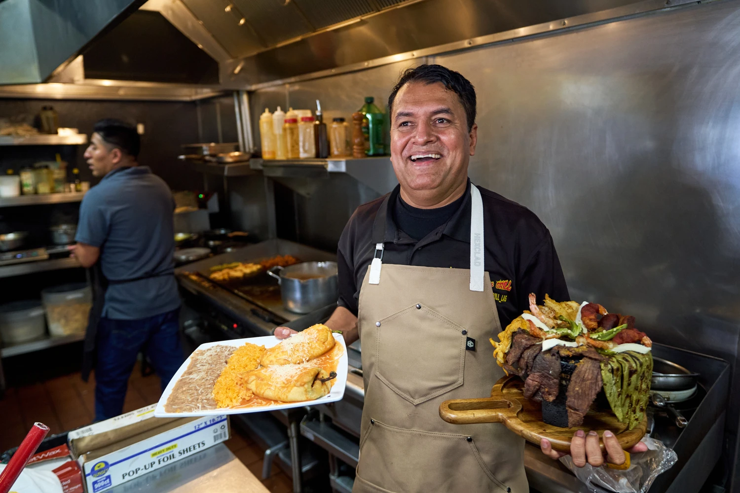 Mexican restaurant owner-chef Marco Mendoza prepares a hot molcajete, a traditional Mexican dish, at Cuernavaca's Grill in downtown Los Angeles, Tuesday, April 28, 2026.