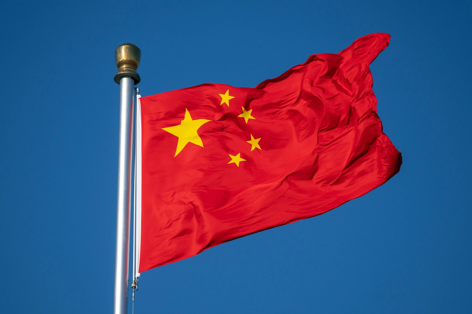A Chinese flag flies at Tiananmen Square in Beijing, China, on Saturday, Feb. 22, 2025.
