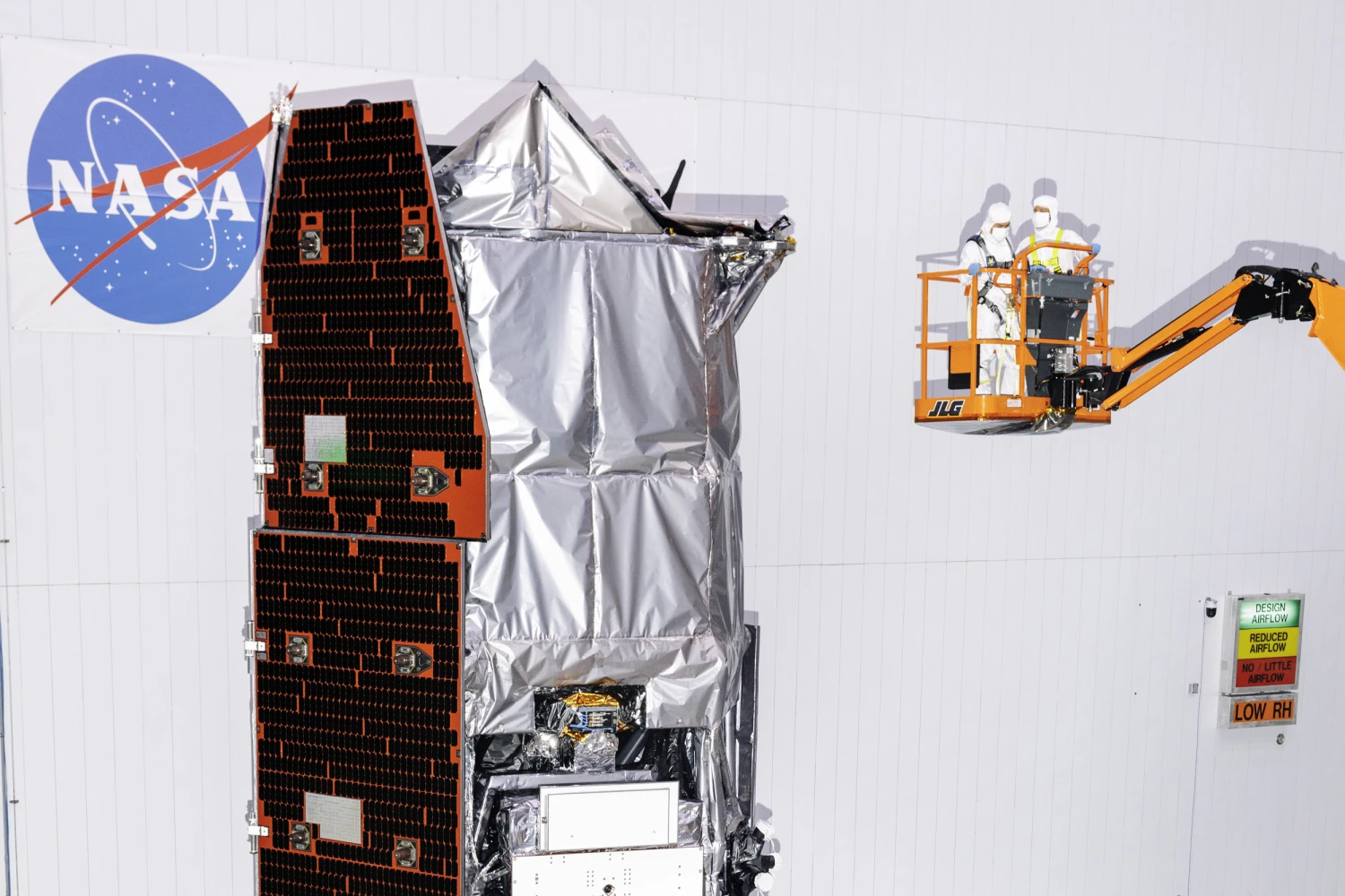 Scientists in a cherry picker observe the top of the Nancy Grace Roman Telescope at NASA Goddard Space Center in Greenbelt, Maryland on May 22, 2026.