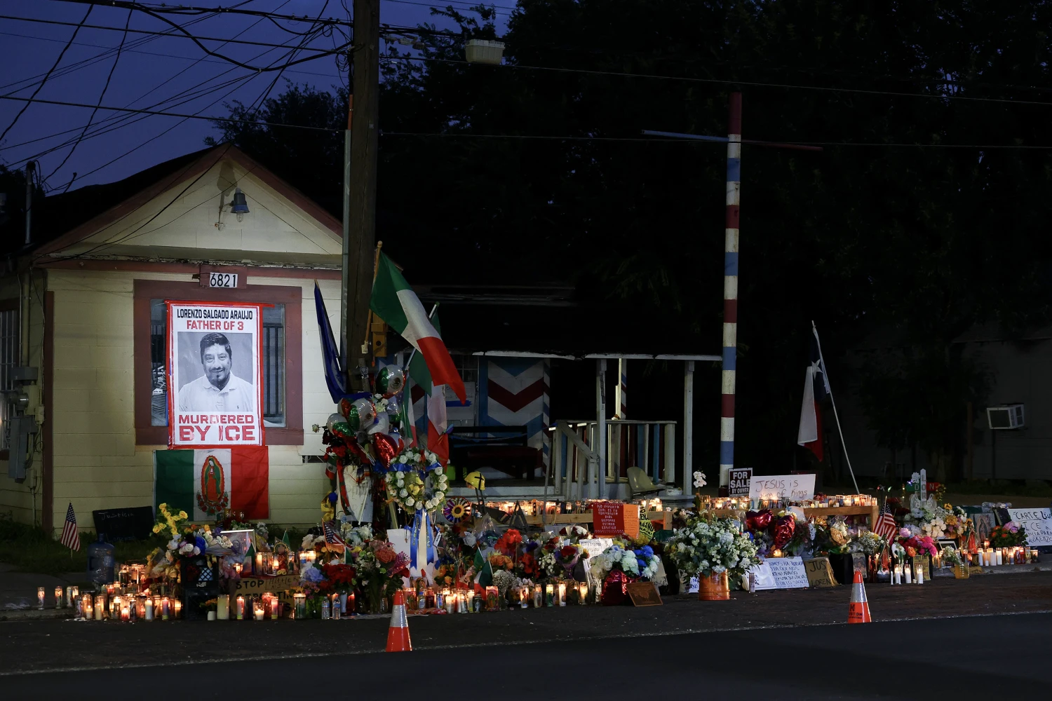 Flowers, candles and hand written messages at a memorial site where Mexican immigrant Lorenzo Salgado Araujo was fatally shot by an Immigration and Customs Enforcement (ICE) officer, Thursday, July 16, 2026, in Houston.