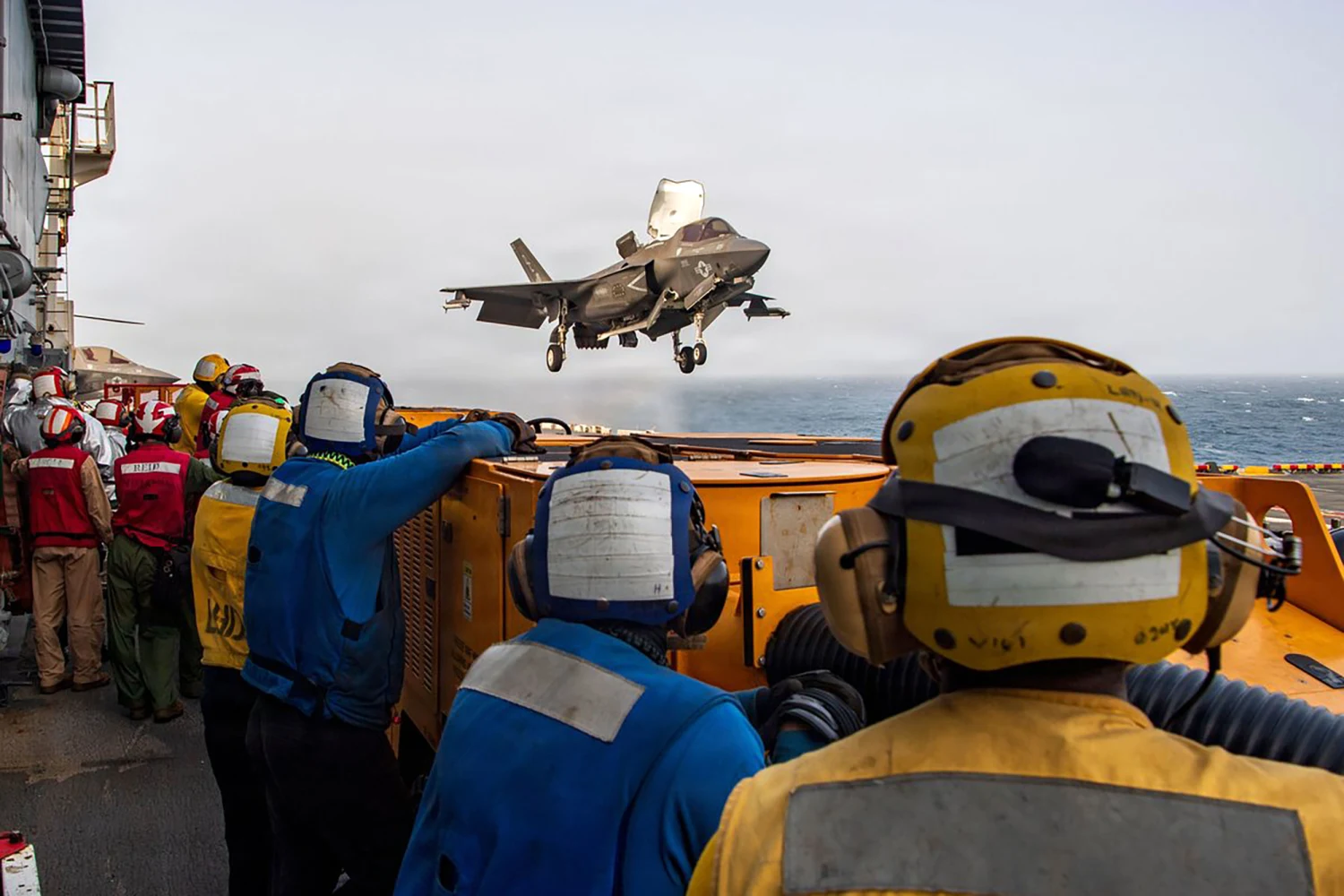 Image posted to X by CENTCOM on Jul 20 2026, alongside caption: U.S. service members aboard amphibious assault ship USS Boxer (LHD 4) support flight operations day and night from the Arabian Sea as CENTCOM enforces the naval blockade against Iran.