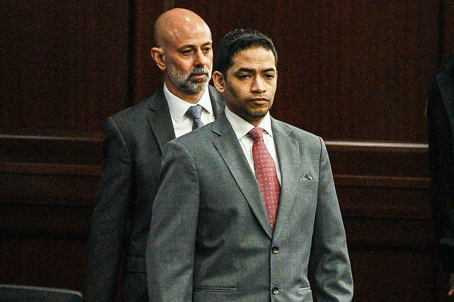 Defendant Mario Fernandez Saldana, center, walks back to his seat during a break in his murder trial on Aug. 26, 2026.