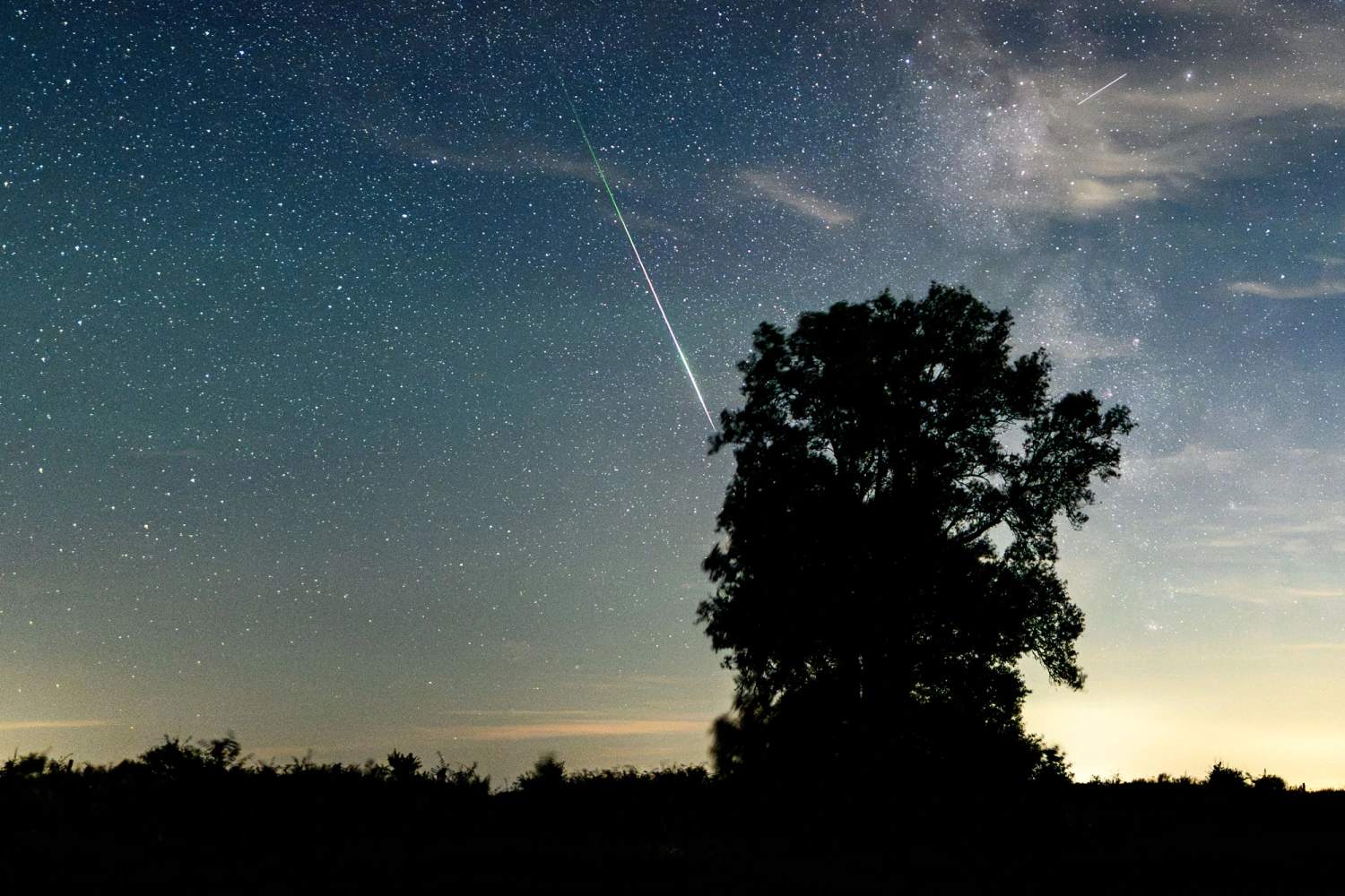 A shooting star from the Perseid meteor shower streaks across the night sky against the backdrop of the Milky Way, in Schleswig-Holstein, Dahmeshöved, Germany, on Aug. 9, 2026.
