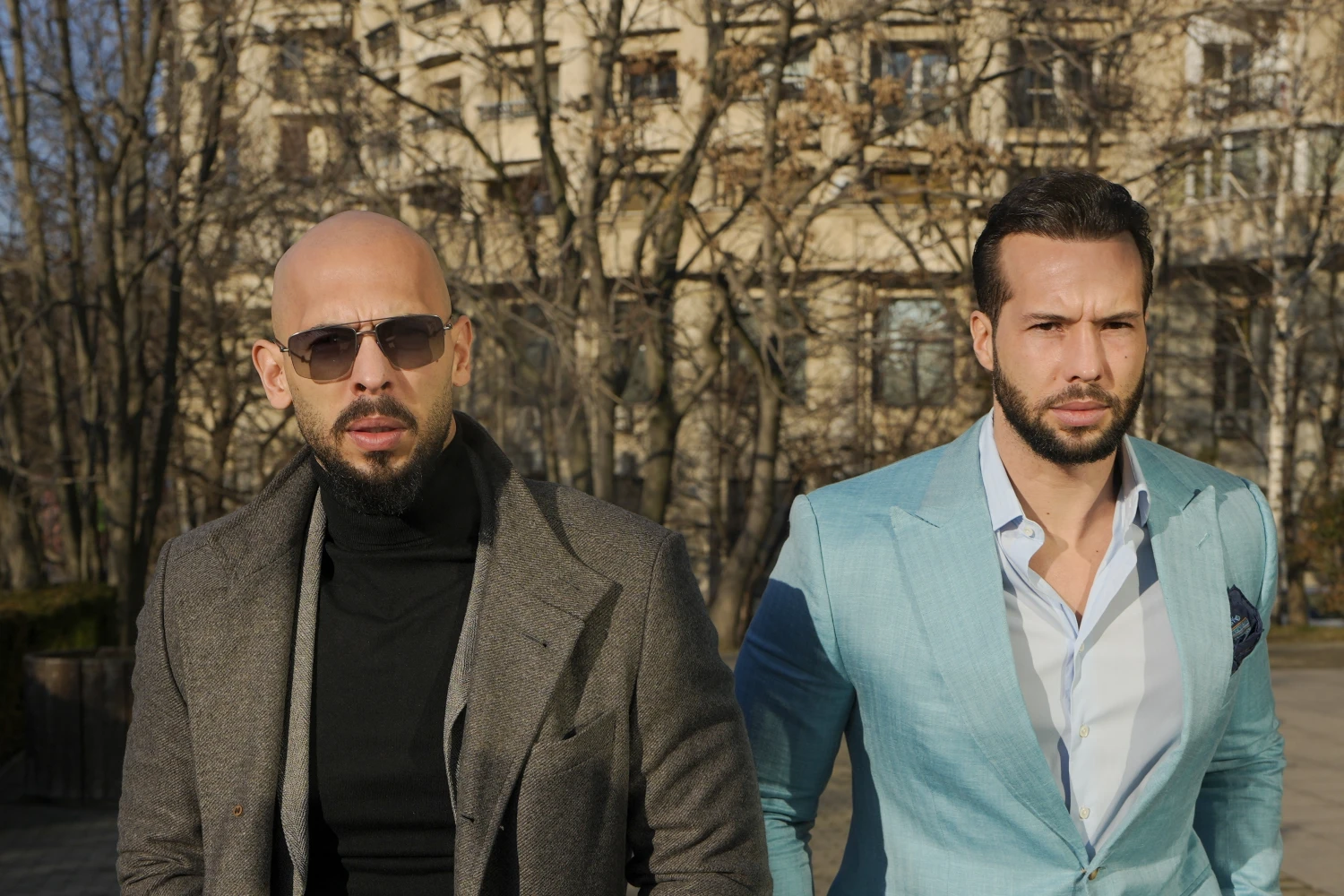 Andrew Tate, left, and his brother, Tristan Tate, arrive at the Bucharest Tribunal in Bucharest, Romania on Feb. 1, 2024.