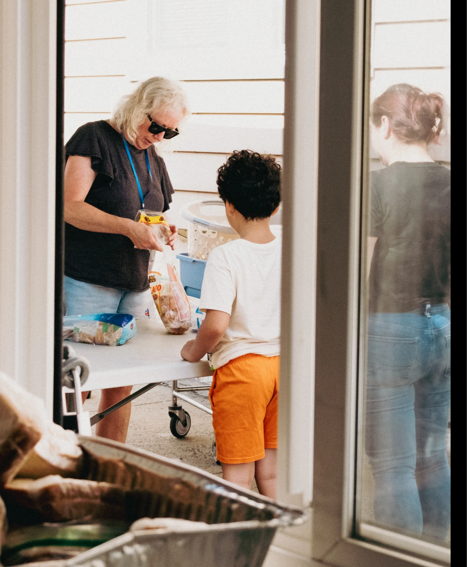Outdoor sandwich distribution at St. Joseph's Social Service Center in Elizabeth, NJ on July 27, 2026.