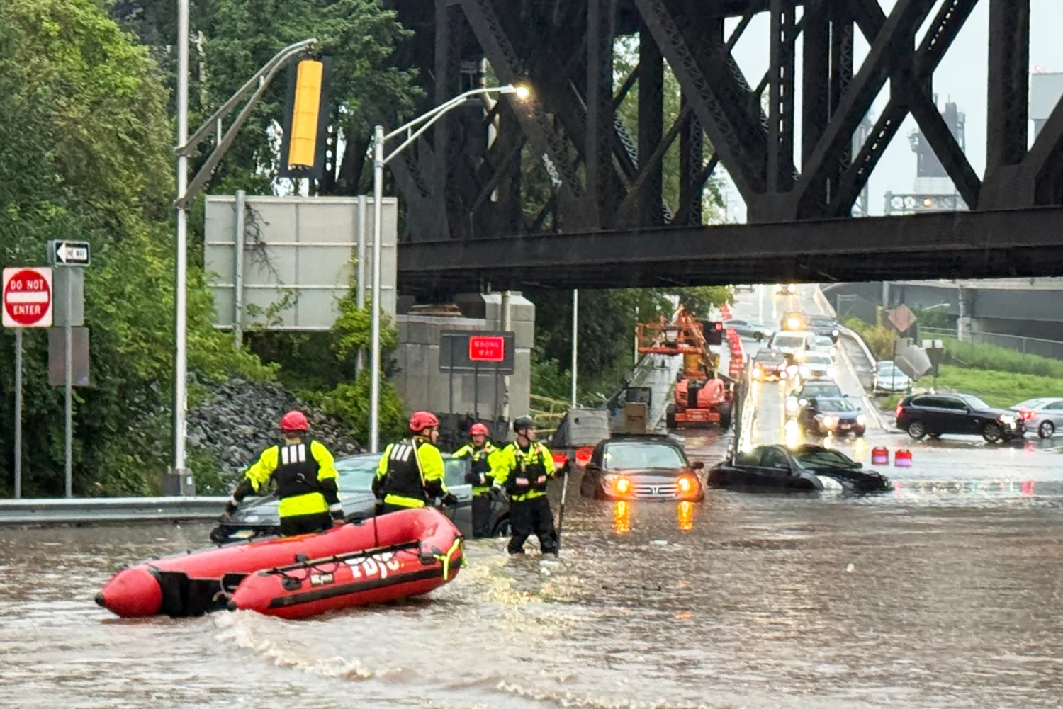 In Jersey City, New Jersey, emergency crews waded through roads with knee-high water with small inflatable boats to help those stranded.