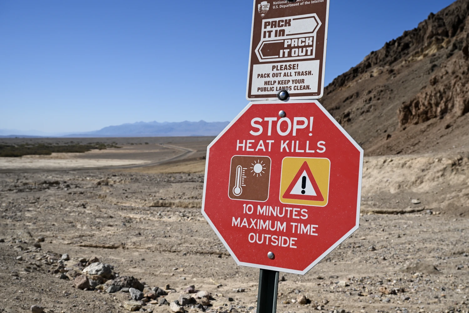 A view of heat warning sign at Golden Canyon as the thermometer that shows 128Â°F (53Â°C) at Furnace Creek Visitor Center in Death Valley National Park of California, United States on August 2, 2026.