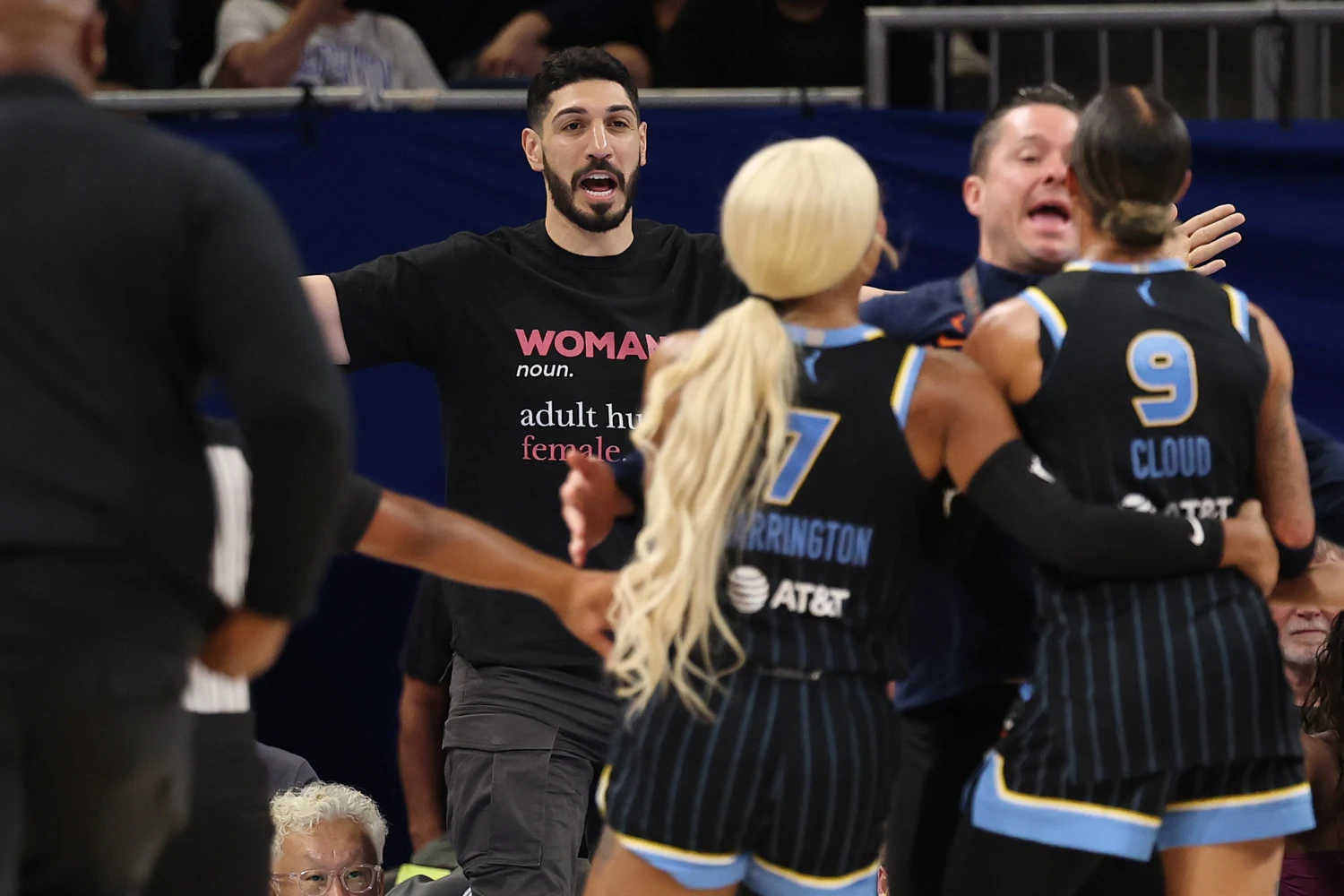 CHICAGO, ILLINOIS - AUGUST 23: Former basketball player Enes Kanter Freedom and Natasha Cloud #9 of the Chicago Sky yell at one another during the second half between the Chicago Sky and the Indiana Fever at Wintrust Arena on August 23, 2026 in Chicago, Illinois.